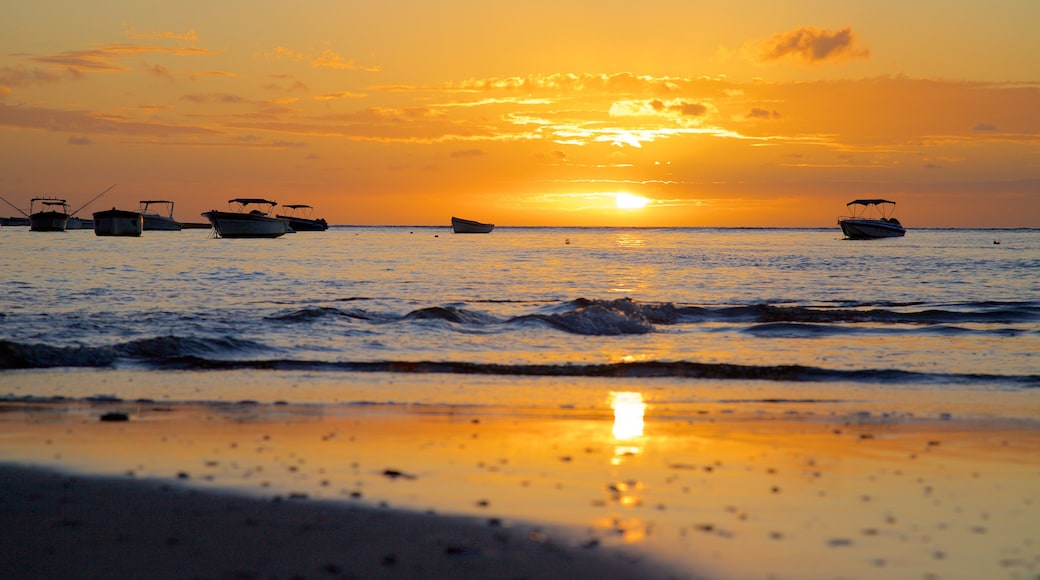 Tamarin showing boating, a sandy beach and a sunset