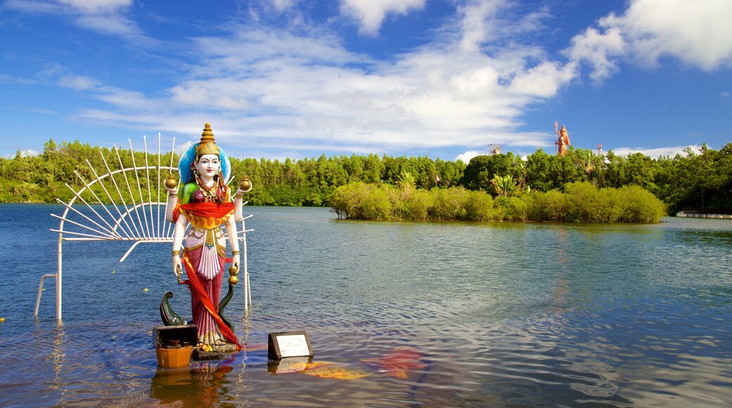 Ganga Talao which includes general coastal views, a statue or sculpture and religious elements