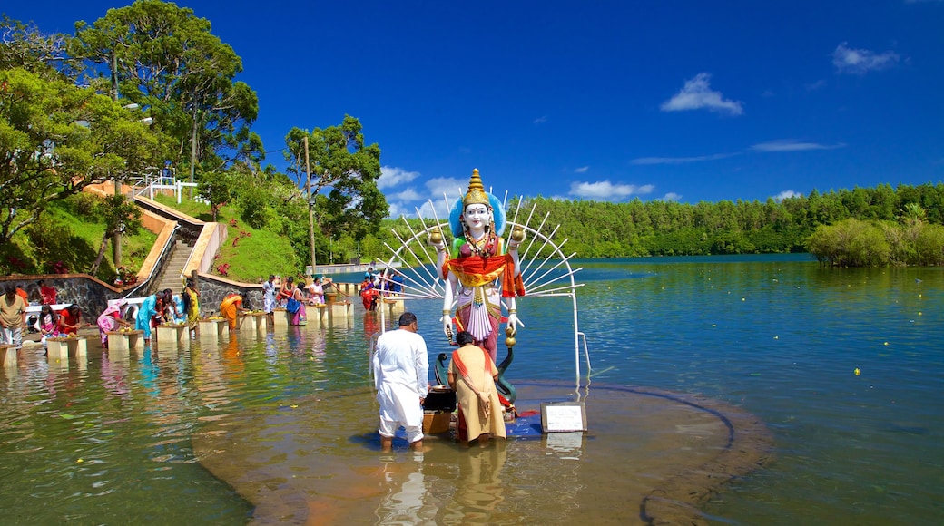 Ganga Talao featuring religious aspects, a lake or waterhole and a statue or sculpture