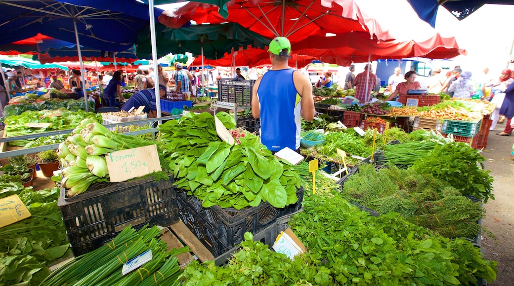 Saint-Paul showing markets and food as well as an individual male