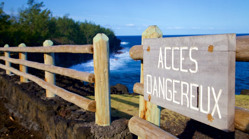 Cape Mechant featuring signage and general coastal views