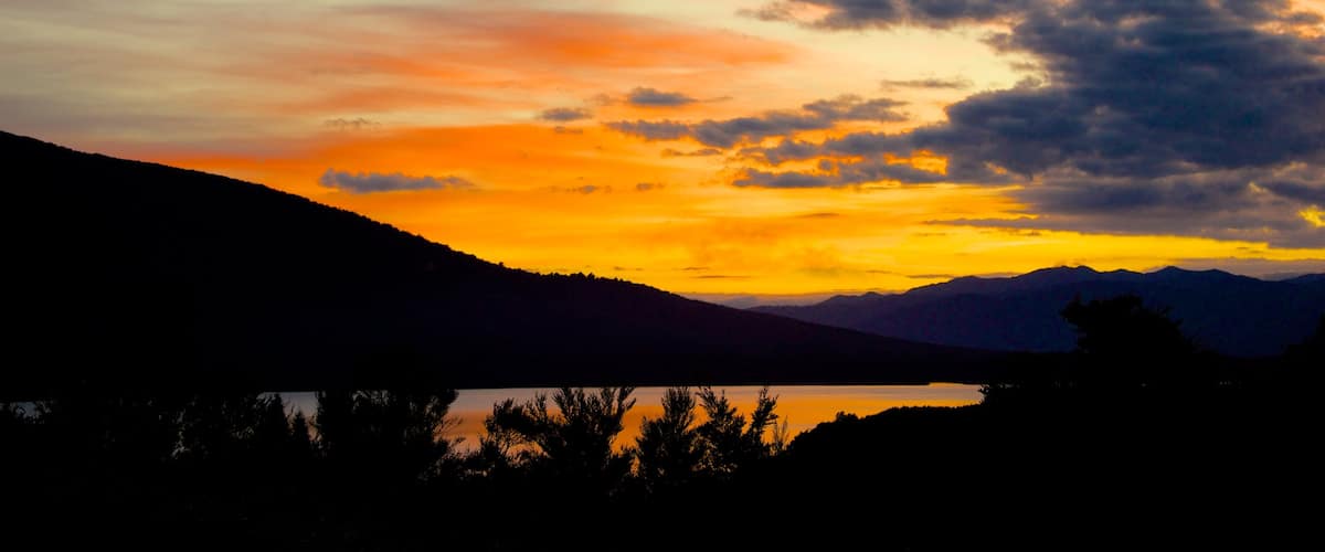 Turangi showing landscape views and a sunset