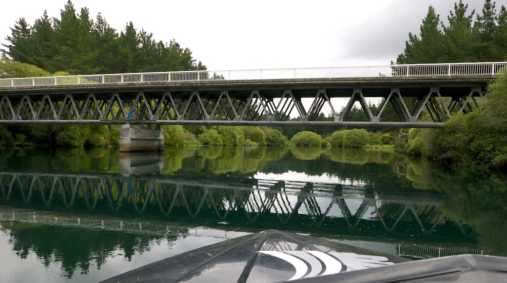 Orakei Korako Geothermal Park and Cave which includes a bridge and a river or creek