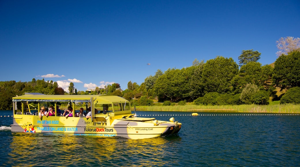 Lake Okareka which includes a lake or waterhole and vehicle touring