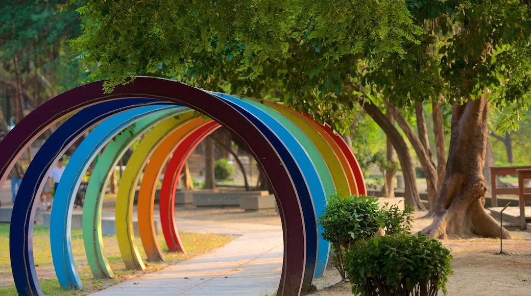 Tainan Park featuring outdoor art and a garden