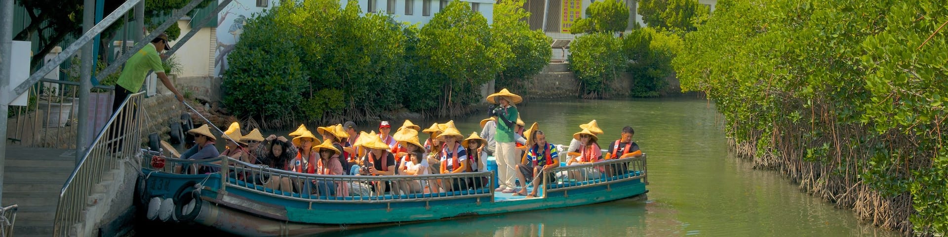 Taijiang National Park which includes a ferry, a river or creek and a temple or place of worship