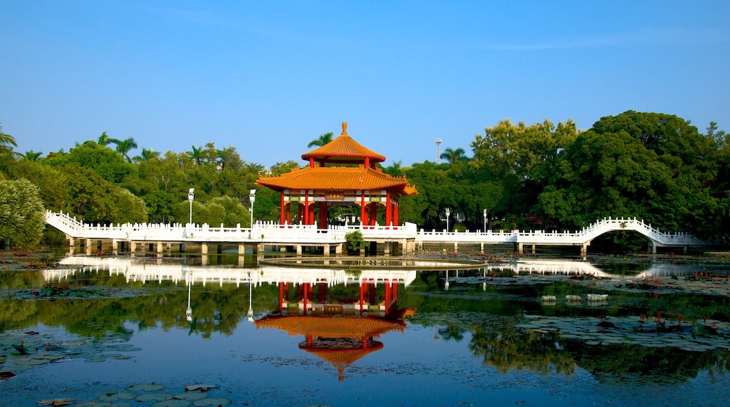 Tainan Park which includes a lake or waterhole and a garden