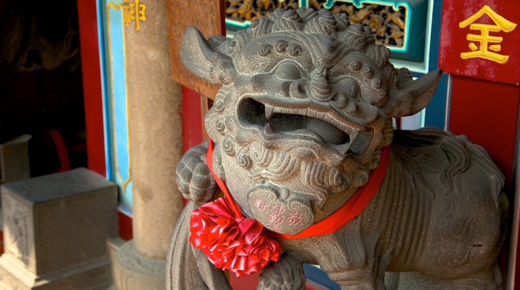 Tainan which includes a temple or place of worship and a statue or sculpture