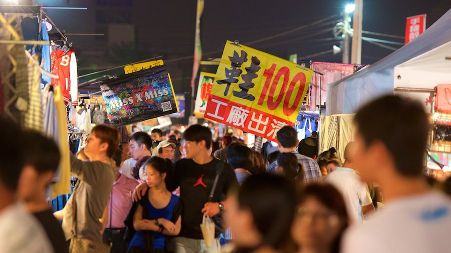 Tainan featuring markets and night scenes as well as a large group of people