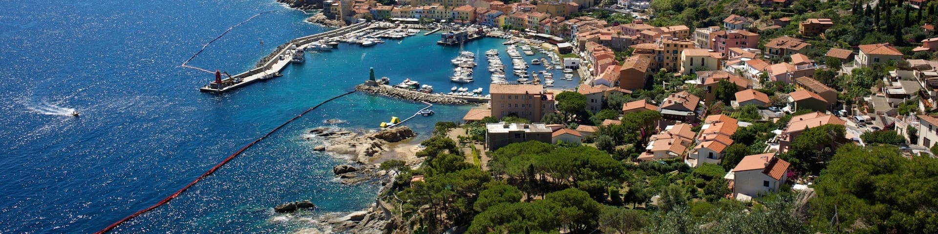 Isola del Giglio featuring a small town or village, a coastal town and general coastal views