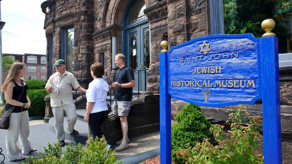 Saint John which includes signage as well as a small group of people