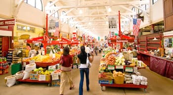 Saint John featuring markets and interior views as well as a small group of people