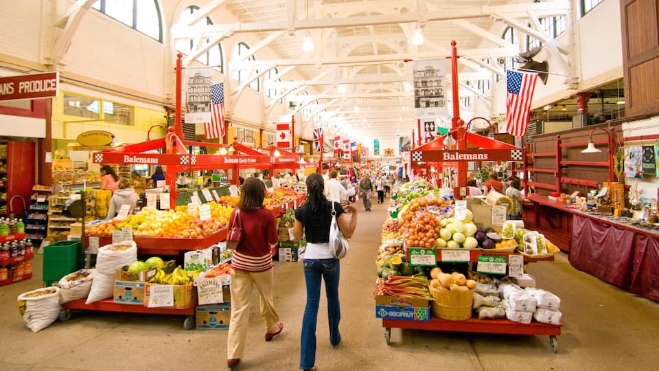 Saint John featuring markets and interior views as well as a small group of people