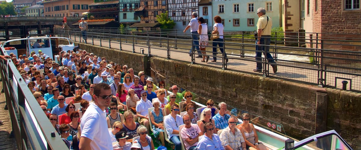 Petite France featuring heritage elements, boating and a city