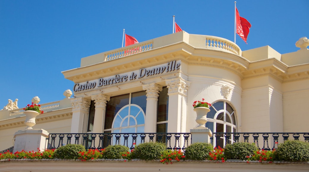 Deauville showing flowers, signage and a casino