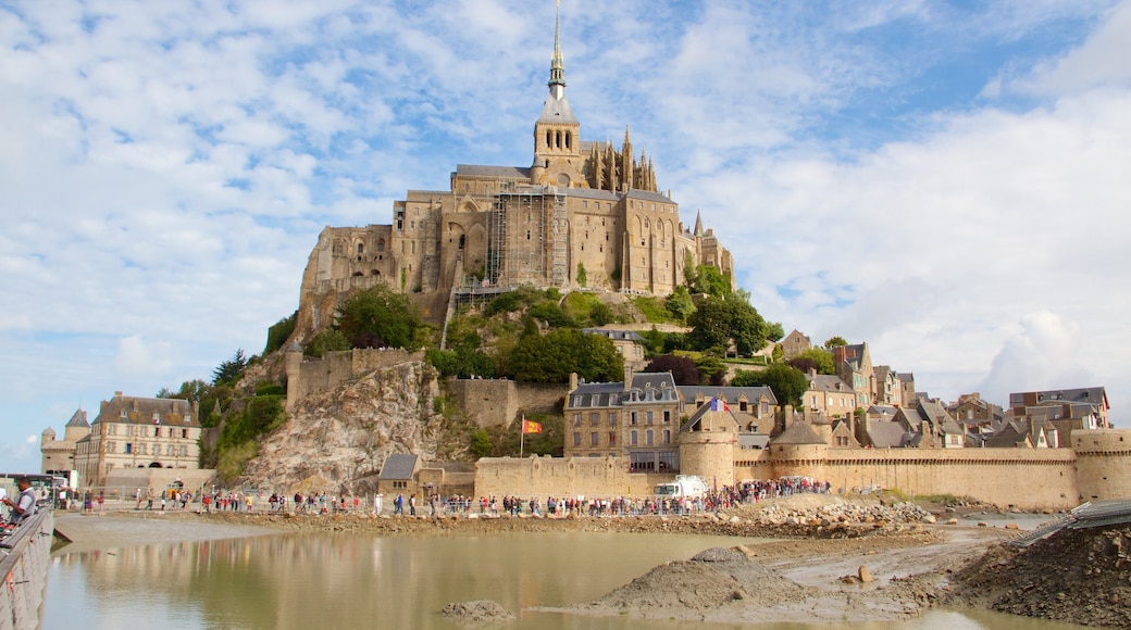 Le Mont-Saint-Michel which includes a small town or village, a castle and heritage elements