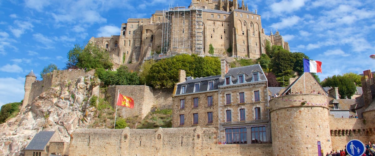 Le Mont-Saint-Michel which includes chateau or palace, heritage elements and a small town or village