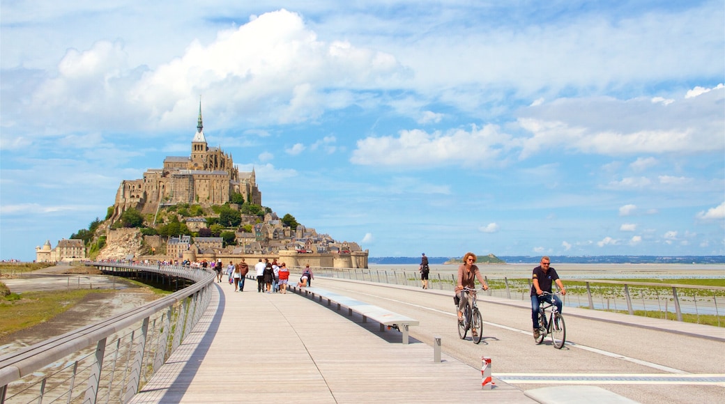 Le Mont-Saint-Michel which includes a small town or village and heritage elements as well as a couple