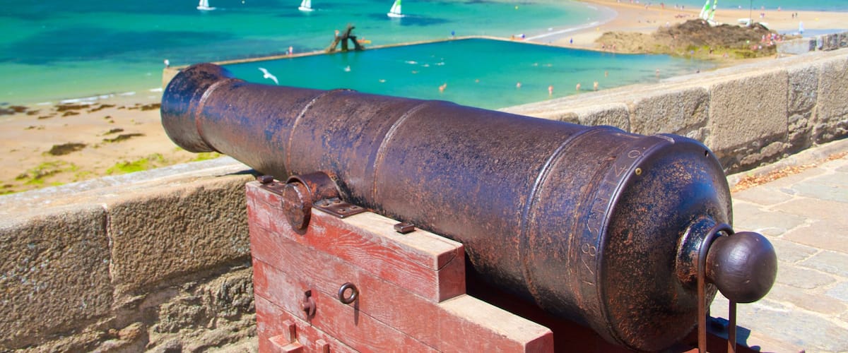 St. Malo Beach showing heritage elements, general coastal views and a bay or harbour