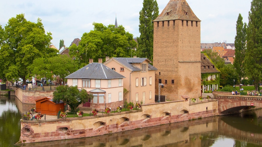 Ponts Couverts which includes a bridge, a river or creek and a small town or village
