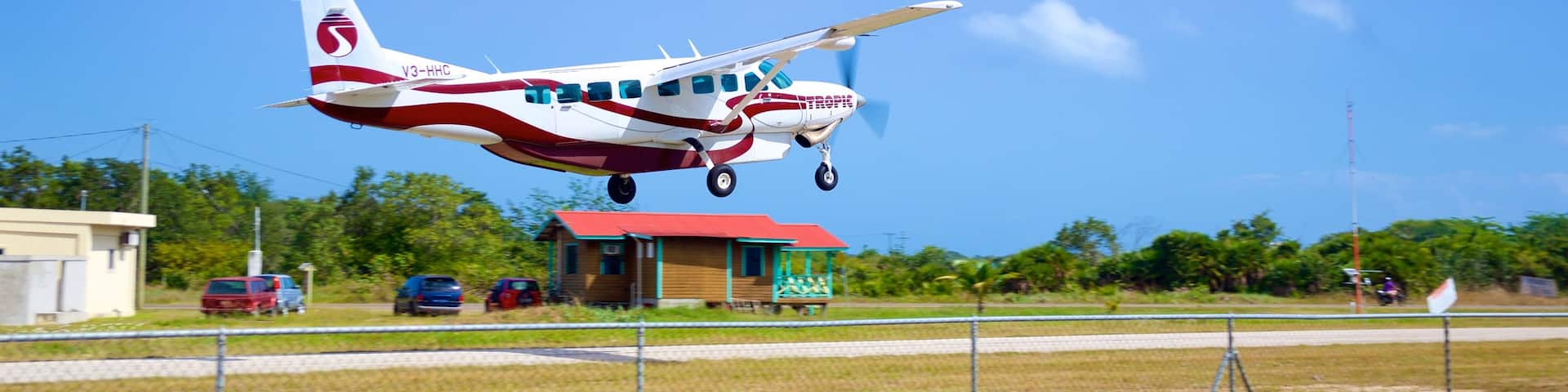 Placencia Beach showing aircraft and an airport