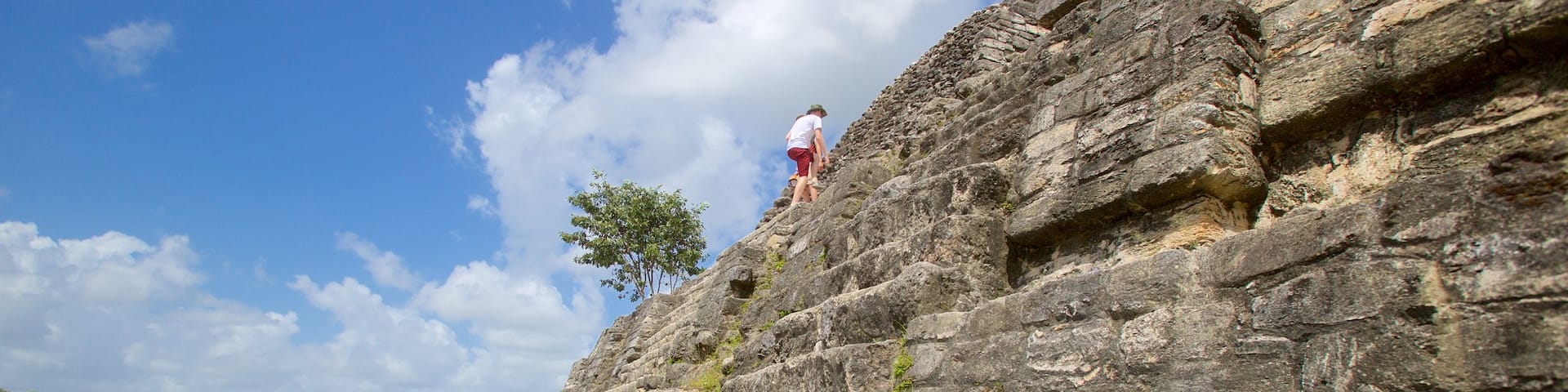 Lamanai featuring indigenous culture and heritage elements as well as a small group of people