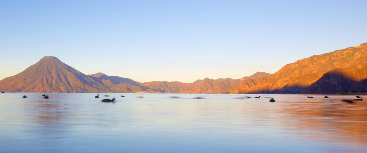San Pedro La Laguna featuring mountains and general coastal views