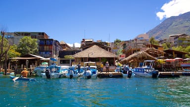 Santiago Atitlan showing a coastal town and a bay or harbor