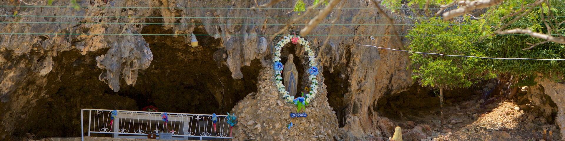 Lourdes Grotto showing caves and religious aspects