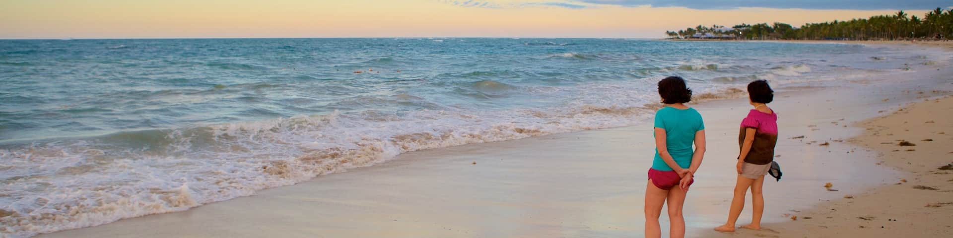 Puerto Plata featuring a beach as well as a small group of people