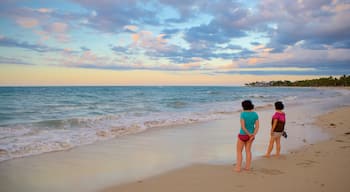 Puerto Plata featuring a beach as well as a small group of people