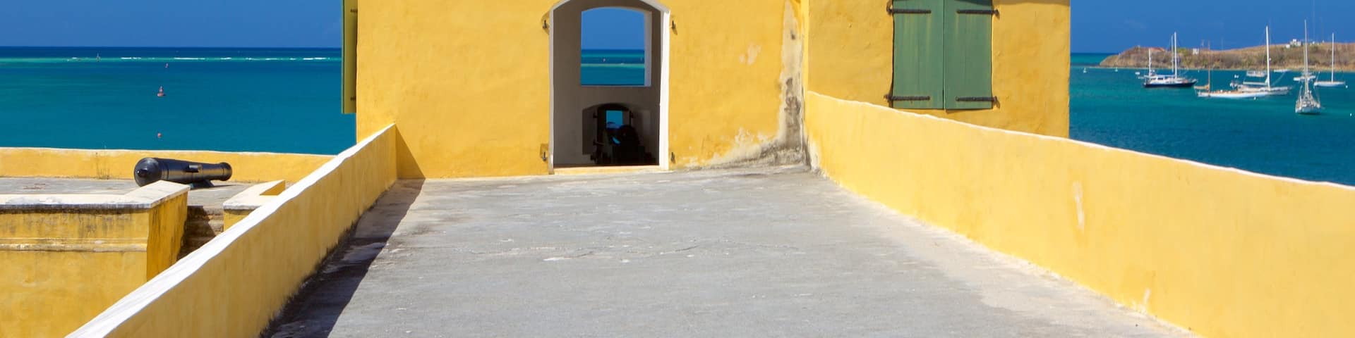 Fort Christiansvaern featuring military items, general coastal views and heritage elements