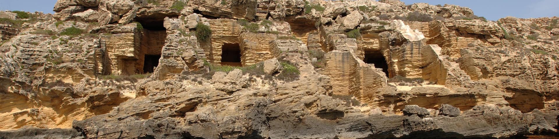 Favignana showing rugged coastline and heritage elements