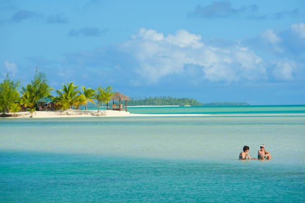 Aitutaki which includes general coastal views as well as a small group of people