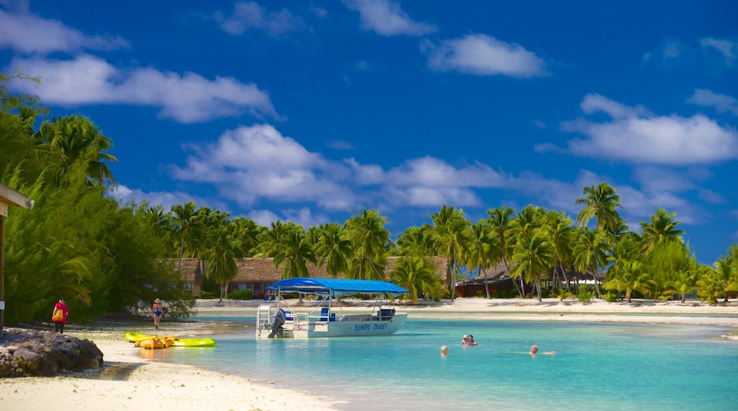 Aitutaki featuring tropical scenes, swimming and a beach