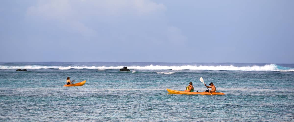 Arorangi showing general coastal views and kayaking or canoeing