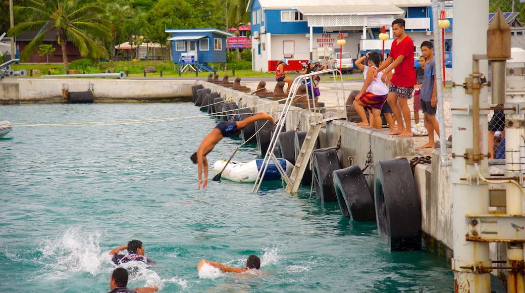 Avarua showing swimming as well as a small group of people