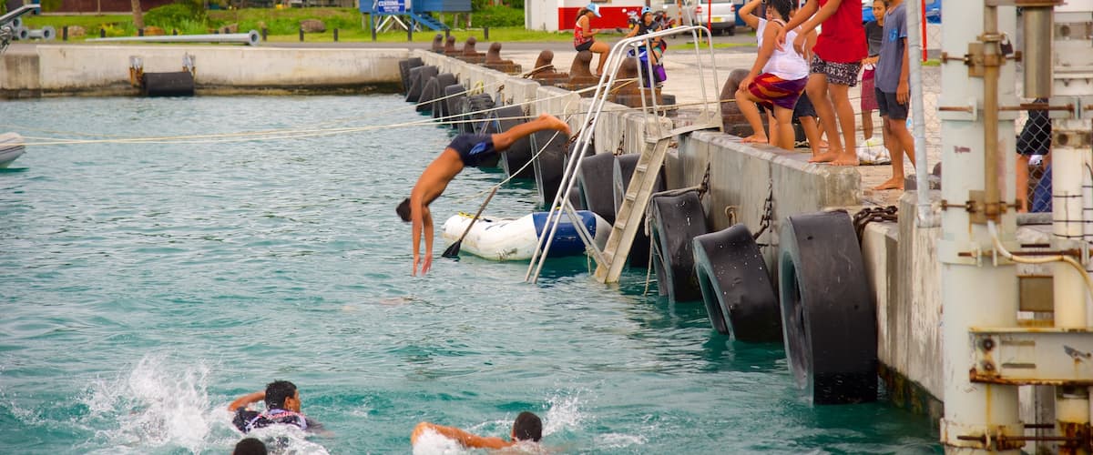 Avarua which includes swimming as well as a small group of people