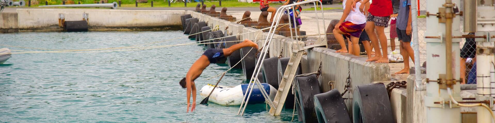 Avarua which includes swimming as well as a small group of people