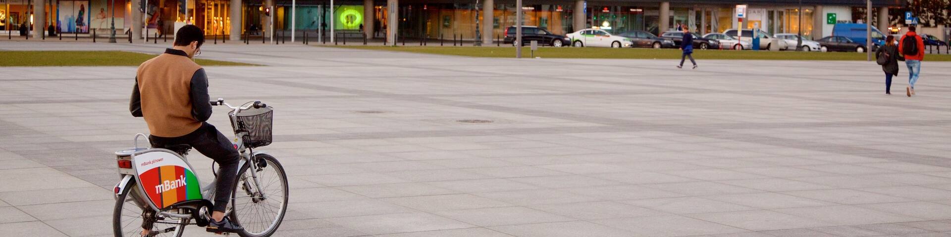 Pilsudski Square which includes a square or plaza and cycling as well as an individual male