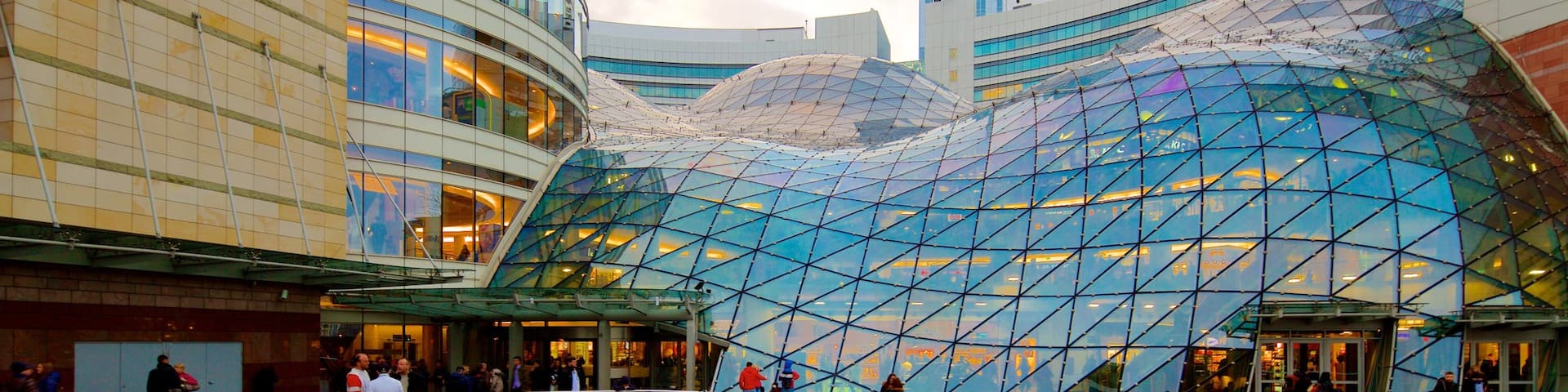 Zlote Tarasy which includes modern architecture and a city