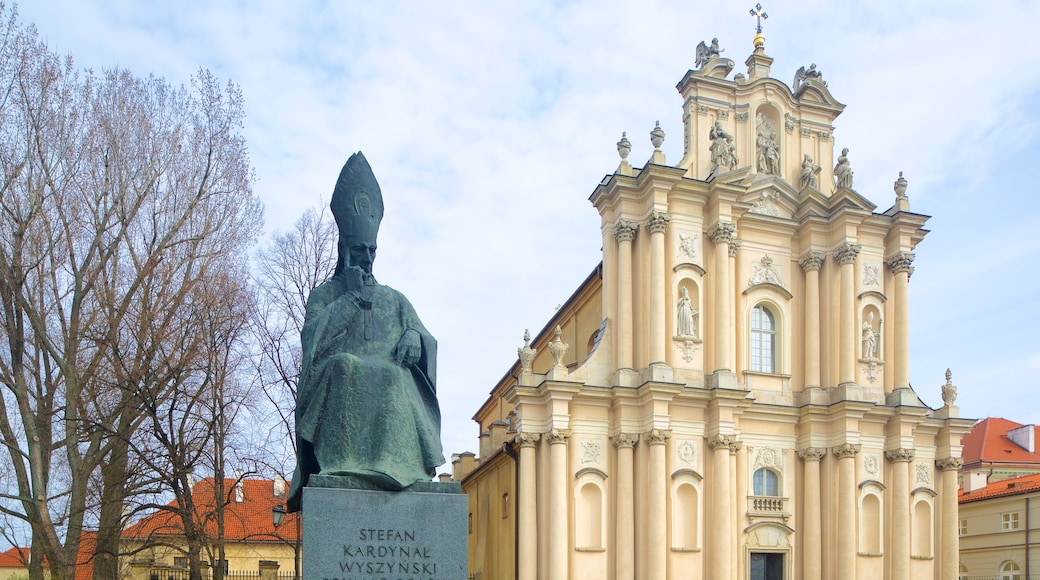 Warsaw which includes a statue or sculpture, a church or cathedral and heritage architecture