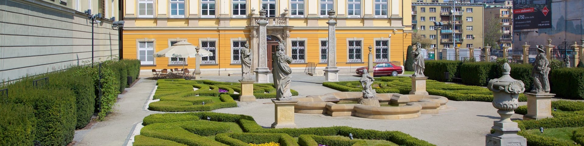 Wroclaw Palace featuring a statue or sculpture, a garden and heritage elements