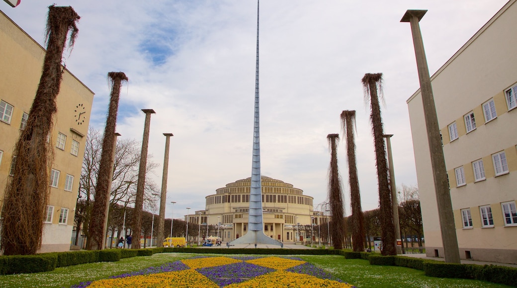 Centennial Hall showing a garden and heritage architecture