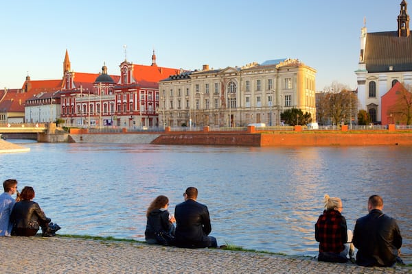 Wroclaw which includes a river or creek as well as a small group of people