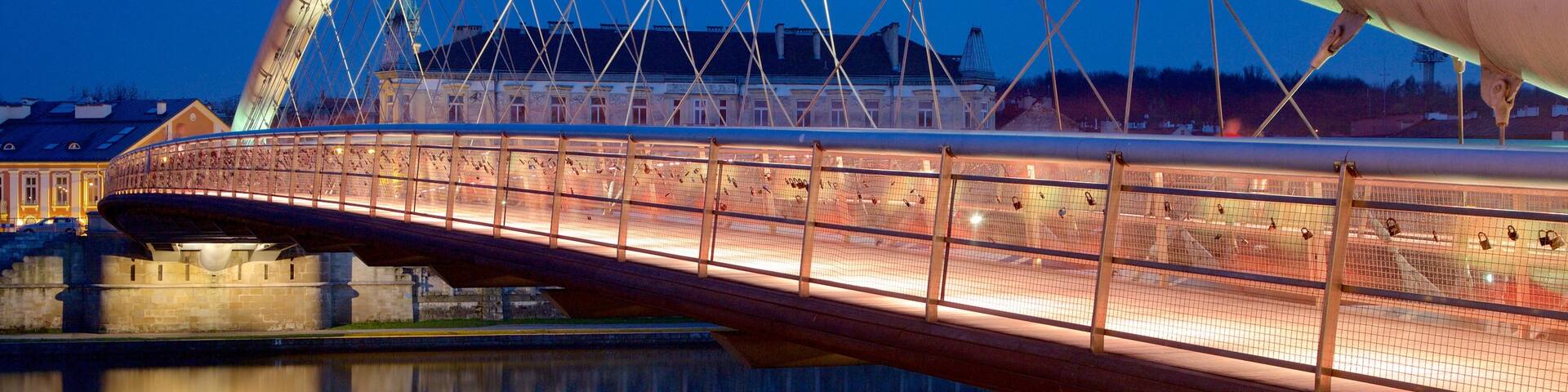 Krakow featuring a bridge and night scenes