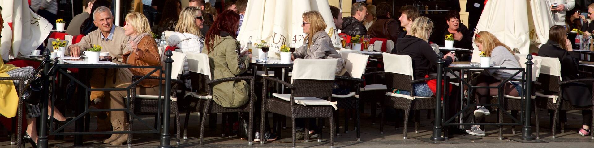 Main Market Square which includes outdoor eating as well as a small group of people