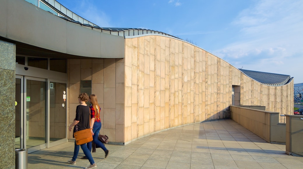 Manggha Museum of Japanese Art and Technology which includes modern architecture as well as a small group of people