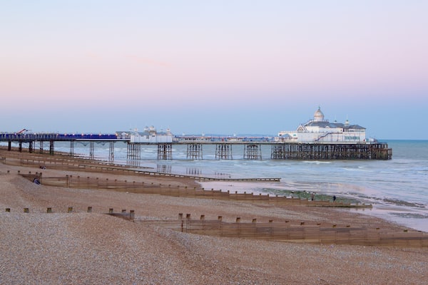 Eastbourne Pier showing general coastal views and a sunset