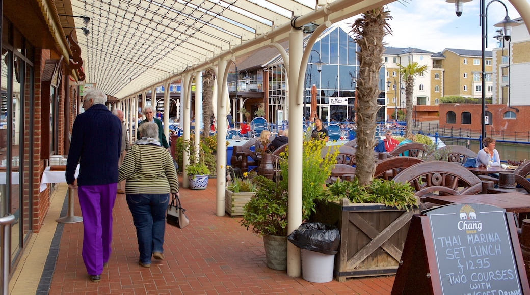 Sovereign Harbour showing outdoor eating and signage as well as a couple